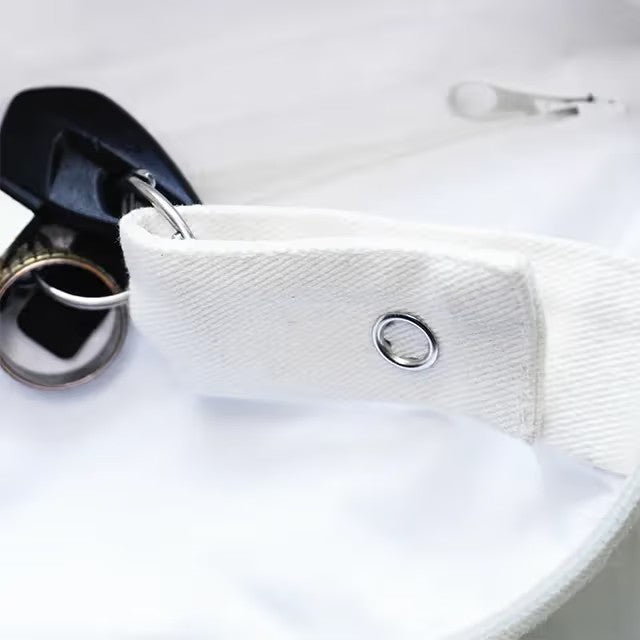 Close-up of bag with keys on a light gray background
