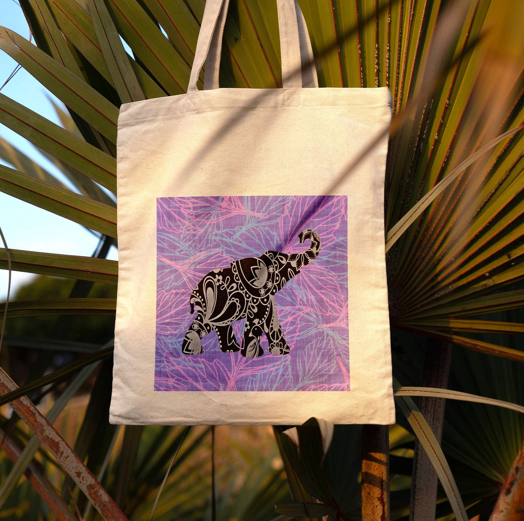 Tote bag with an elephant design on a leafy background