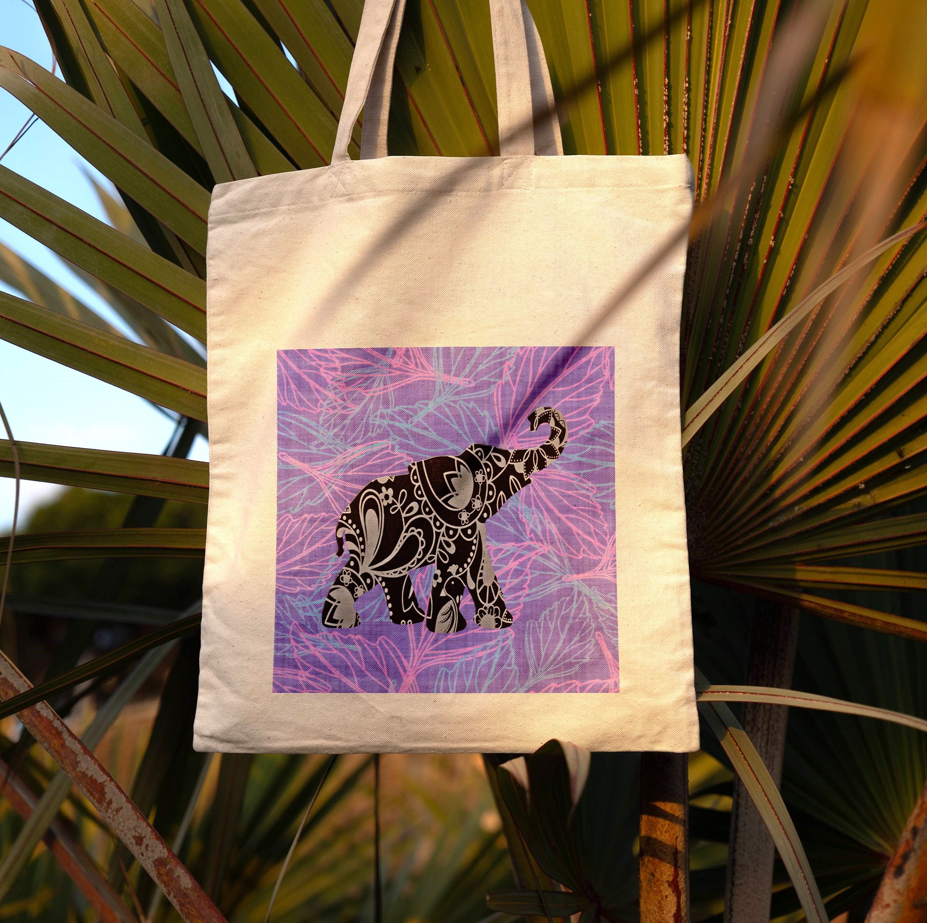 Tote bag with an elephant design on a leafy background