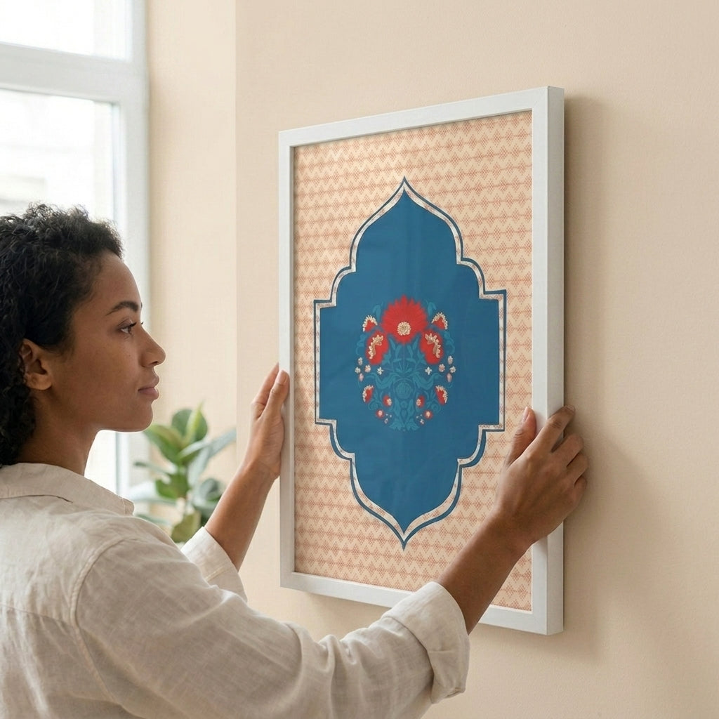Woman hanging a framed decorative piece on a wall