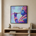 A framed colorful wall art print depicting a divine figure in profile holding a flute, displayed above a light wood shelf in a beige interior setting.