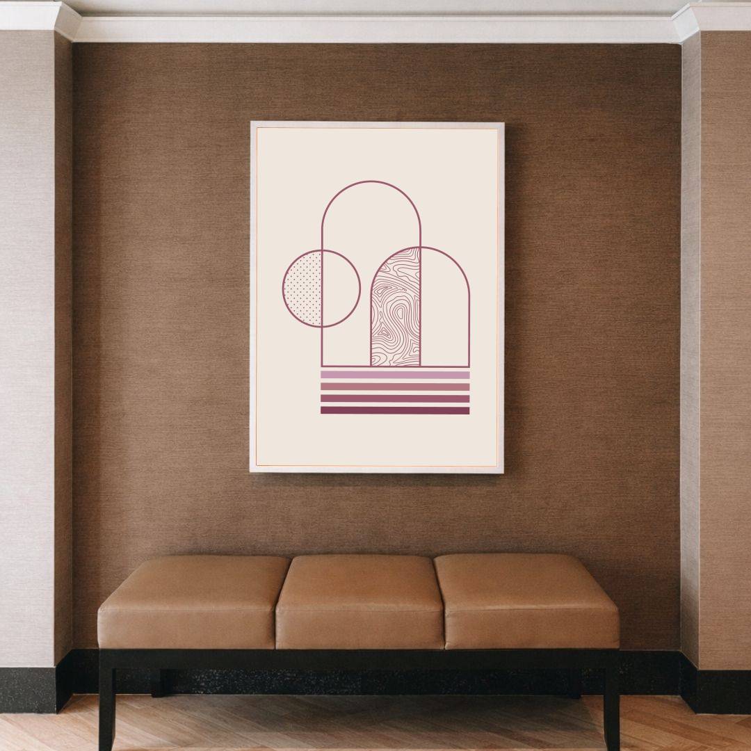 Framed abstract art on a brown wall above a beige bench.
